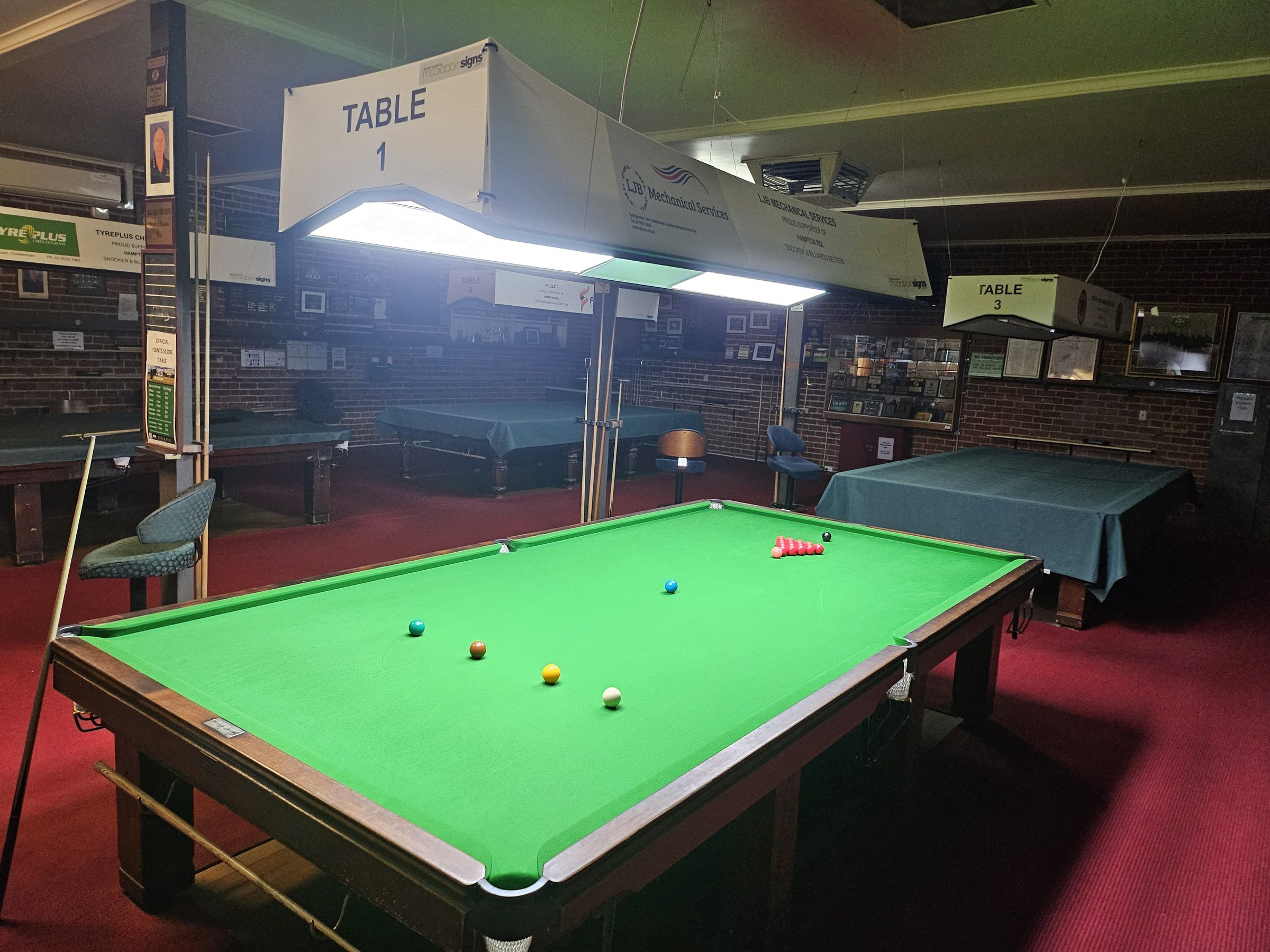 A full size table in the snooker and billiards room